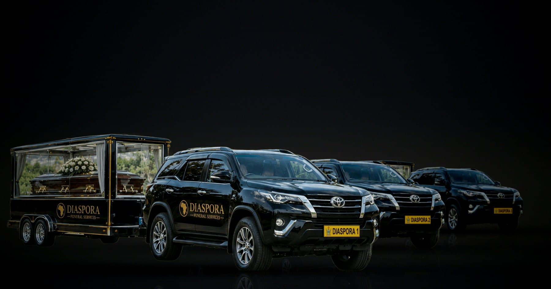 The Diaspora Funeral Services fleet: a glass hearse trailer and three black Toyota Fortuners, plates Diaspora 1, 2 and 3